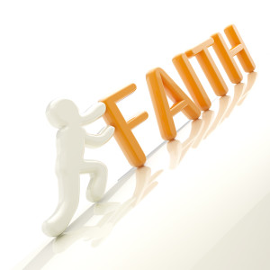Human figure pushing the word "faith" uphill